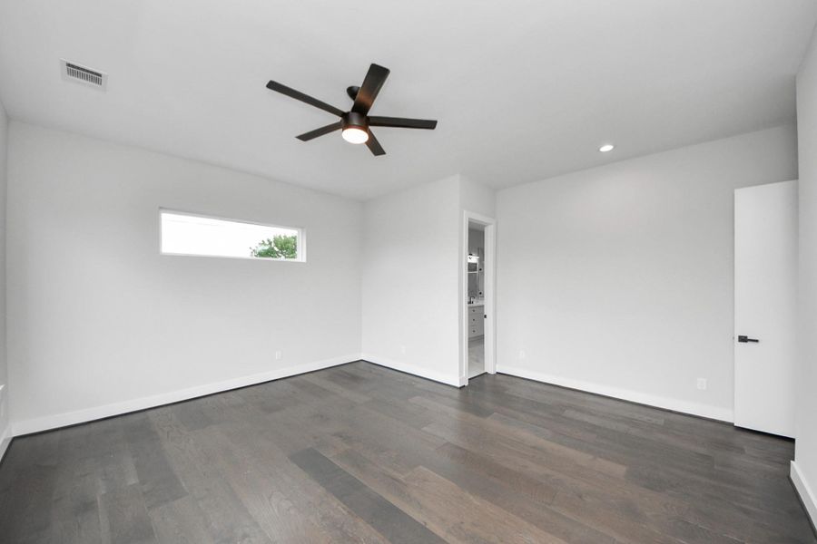 Primary bedroom alternate angle showing natural light