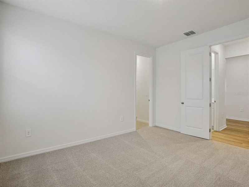 Spacious, unfurnished interior of a new home in Coasterra - Reserve Series, Palmetto (Image 17).