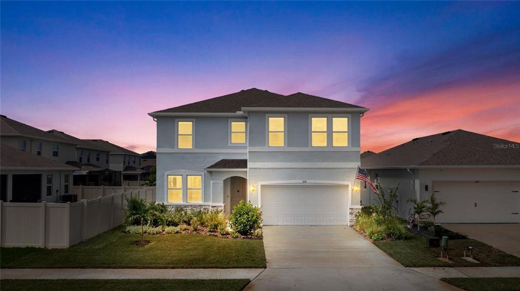 Front exterior of a new home in Silverstone North, Palmetto, FL, highlighting curb appeal (Image 27). Front exterior of a new home in Silverstone North, Palmetto, FL, highlighting curb appeal (Image 27).