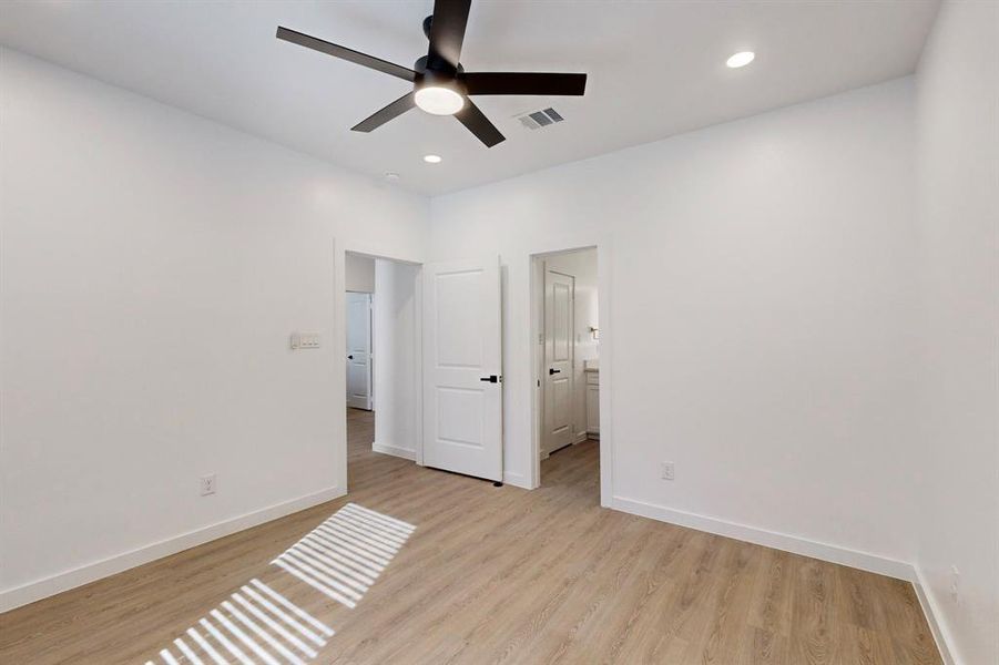 Bedroom featuring light wood-type flooring and ceiling fan