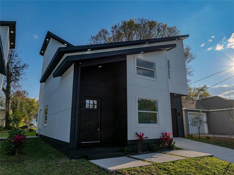 Front exterior of a new home in , Lakeland, FL, highlighting curb appeal (Image 26).