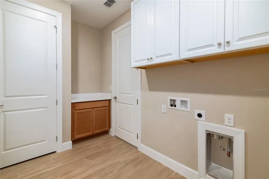 Furnished interior view inside a new home in Esplanade at Wiregrass Ranch, Wesley Chapel (Image 6).
