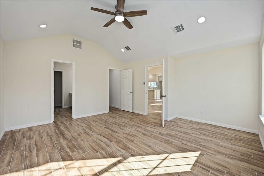 Spacious primary bedroom located at the back of the home for added privacy.