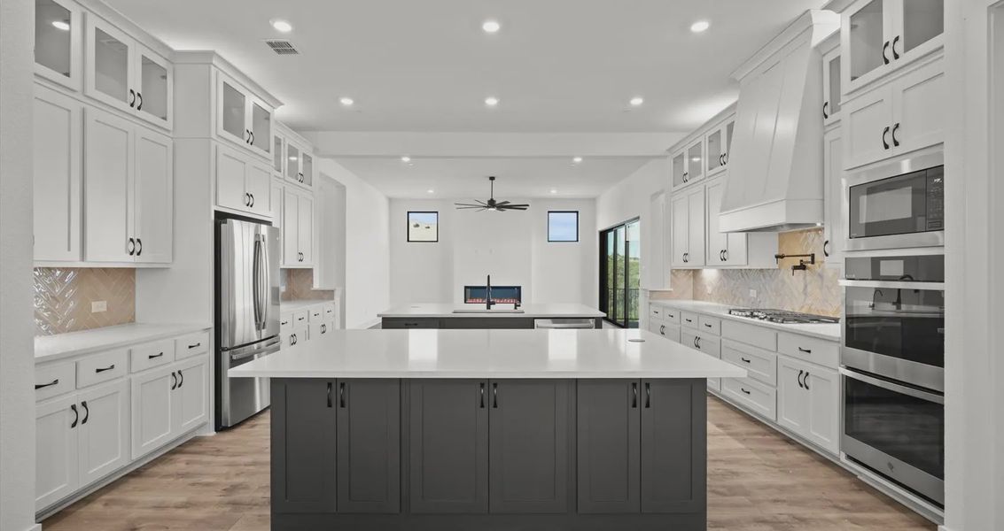 Representative furnished interior of a home built from the Allison by Chesmar Homes in Sweetwater, Austin (Image 8).