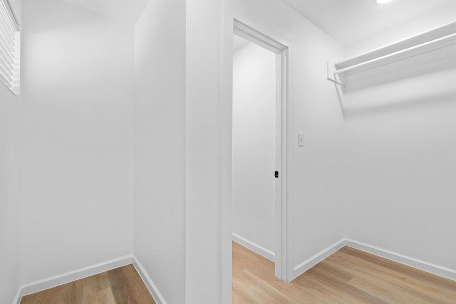 Walk in closet featuring hardwood / wood-style floors