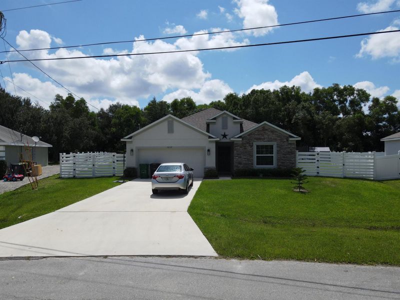 Front exterior of a new home in , Port St. Lucie, FL, highlighting curb appeal (Image 20).