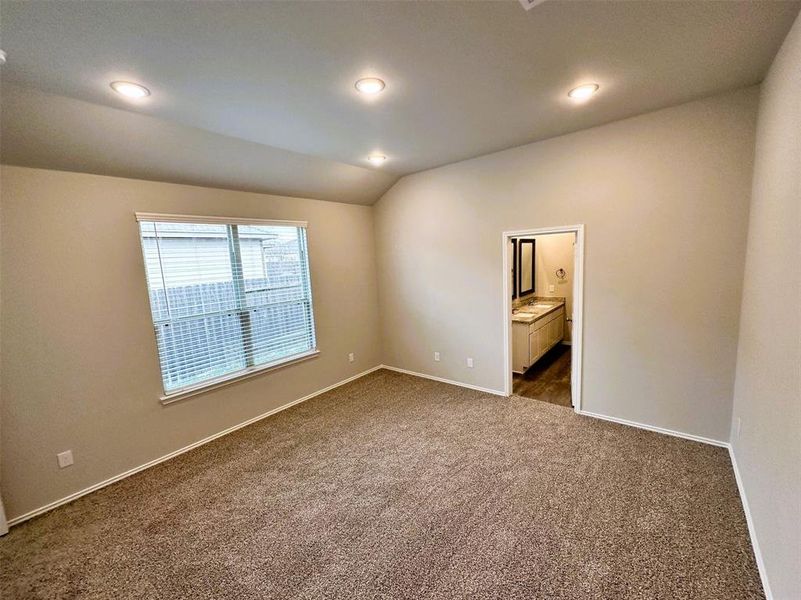 Master bedroom has a soaring vaulted ceiling!