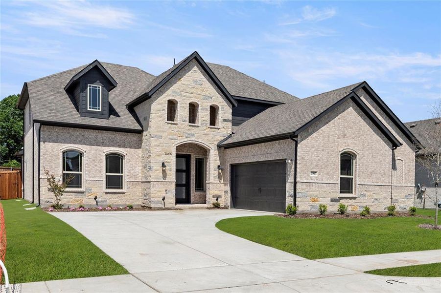Front exterior of a new home in Lake Shore Village, Rowlett, TX, highlighting curb appeal (Image 1).