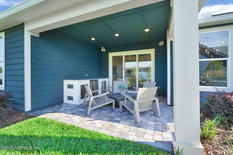Front exterior of a new home in Summer Bay at Grand Oaks, St. Augustine, FL, highlighting curb appeal (Image 2). Front exterior of a new home in Summer Bay at Grand Oaks, St. Augustine, FL, highlighting curb appeal (Image 2).