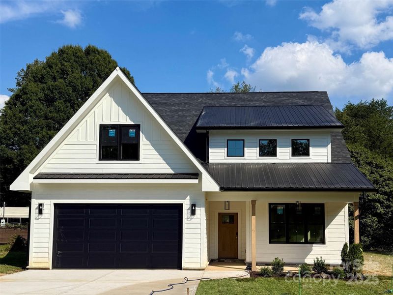 Front exterior of a new home in , Mooresville, NC, highlighting curb appeal (Image 1).