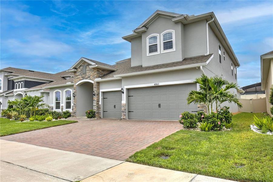 Front exterior of a new home in , Clermont, FL, highlighting curb appeal (Image 1). Front exterior of a new home in , Clermont, FL, highlighting curb appeal (Image 1).