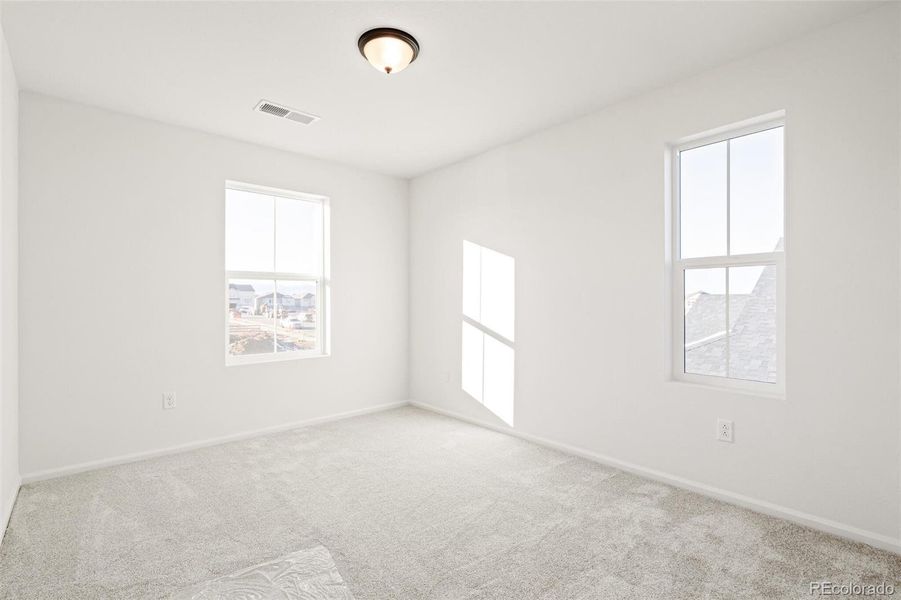 Spacious, unfurnished interior of a new home in The Nest Classic at Canyon Creek, Erie (Image 16).