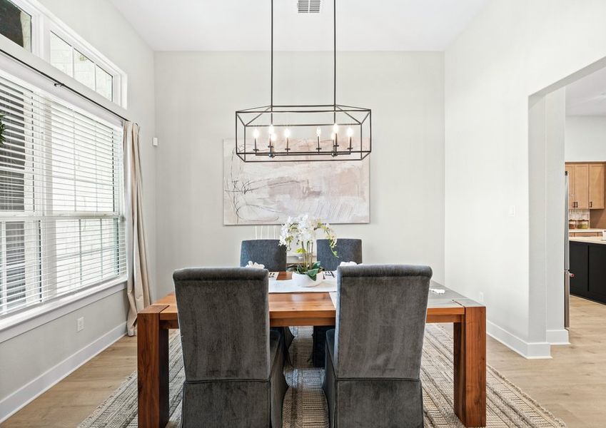 The formal dining room has a large window that lets in great, natural light.