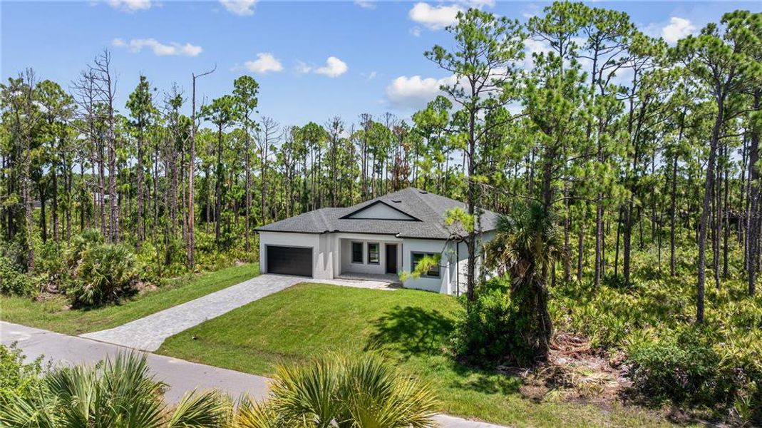 Front exterior of a new home in , Port Charlotte, FL, highlighting curb appeal (Image 32). Front exterior of a new home in , Port Charlotte, FL, highlighting curb appeal (Image 32).