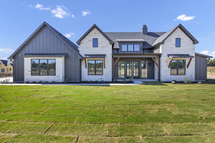 Front exterior of a new home in Oak Water Ranch, Granbury, TX, highlighting curb appeal (Image 2).