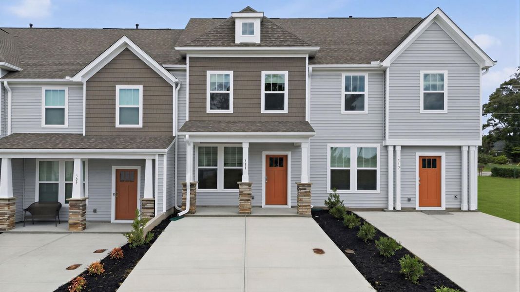 Front exterior of a new home in Clarke Townes, Anderson, SC, highlighting curb appeal (Image 20). Front exterior of a new home in Clarke Townes, Anderson, SC, highlighting curb appeal (Image 20).