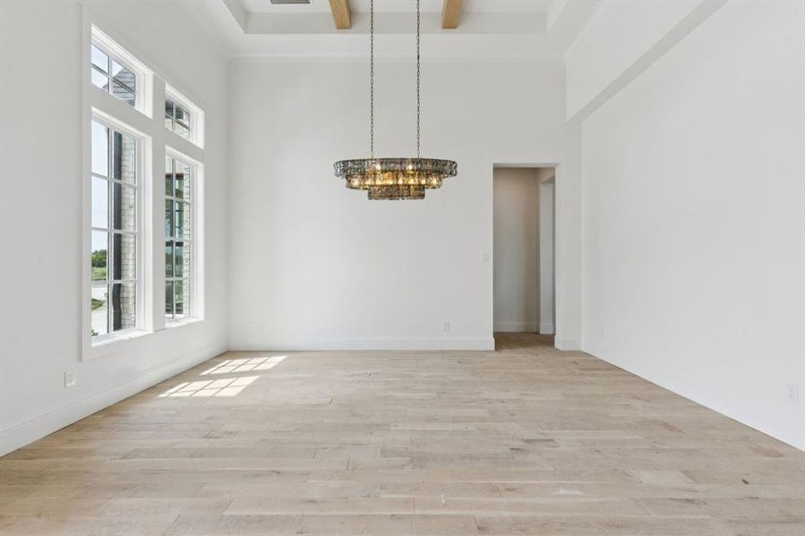 Formal dining with intricate lighting, wood beams, and butler's pantry that leads to your gourmet kitchen.