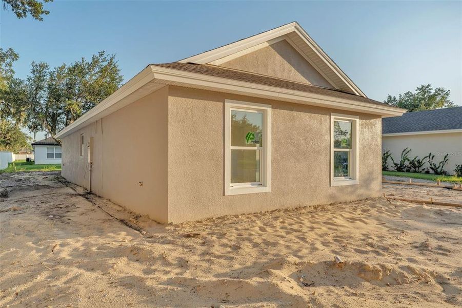 Front exterior of a new home in , Bartow, FL, highlighting curb appeal (Image 16).