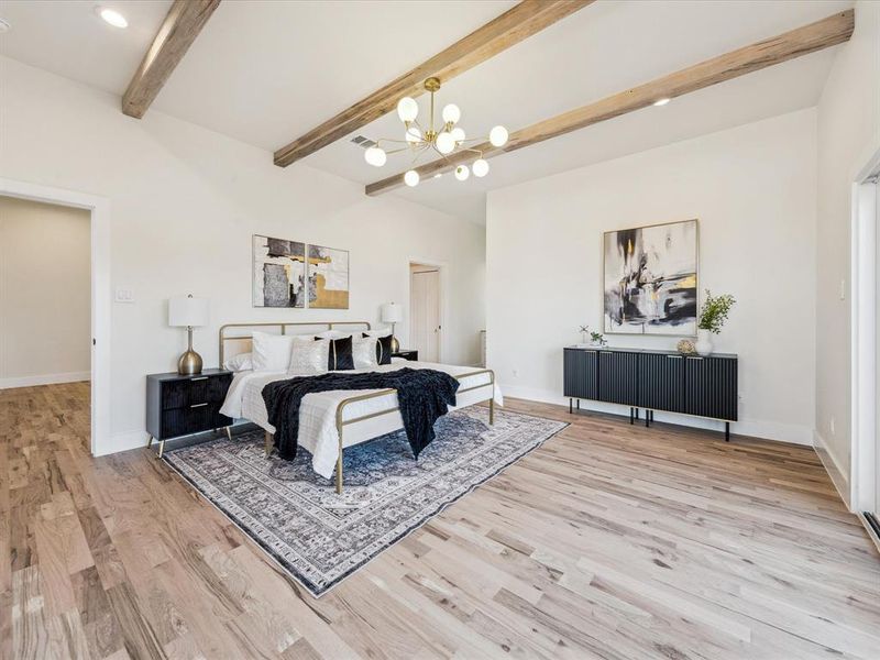 Bedroom with a chandelier, beam ceiling, and wood-type flooring