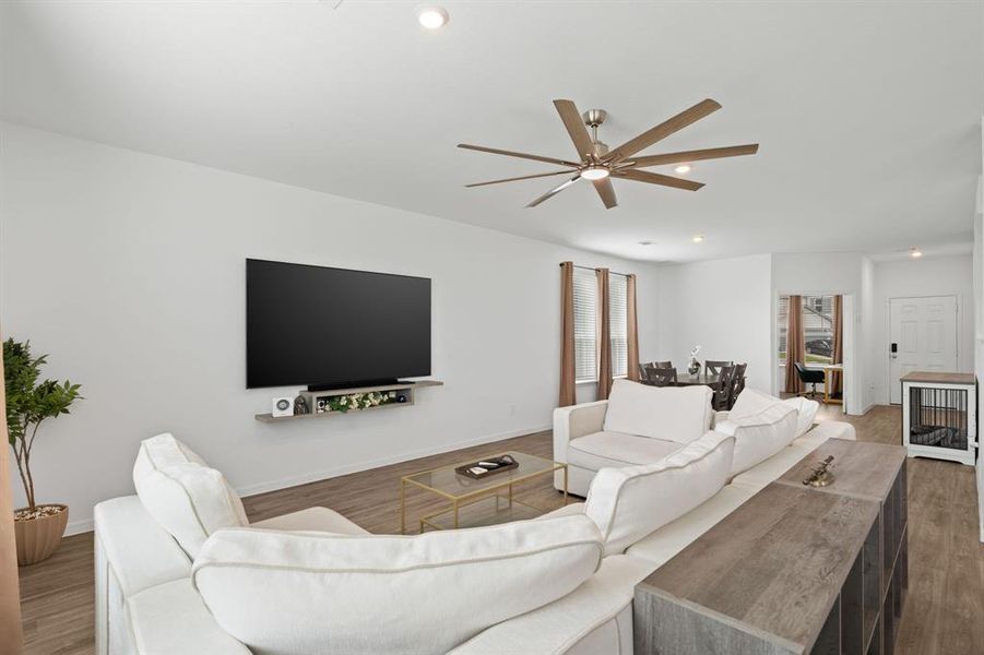 The Luxurious Living Room offers SOARING ceilings, breathtaking view of the Beautiful Backyard, and convenient access to the Gourmet Kitchen and Dedicated Dining Area. Perfect for hosting guests and large gatherings!