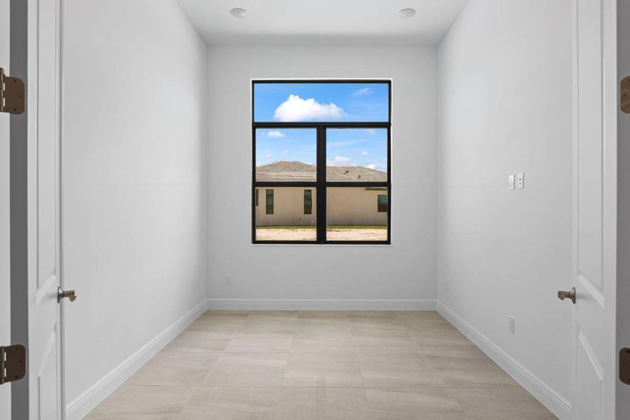 Front exterior of a new home in Cresswind Palm Beach at Westlake, Westlake, FL, highlighting curb appeal (Image 19).