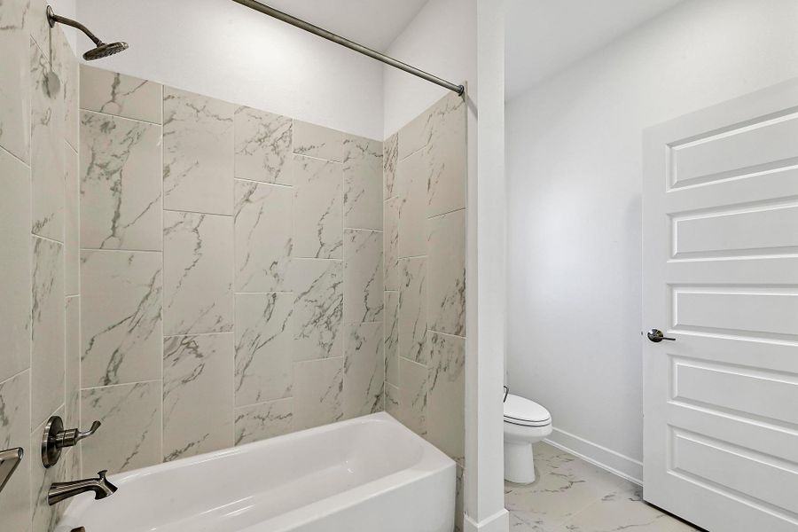 Furnished interior view inside a new home in Rough Hollow, Austin (Image 5).