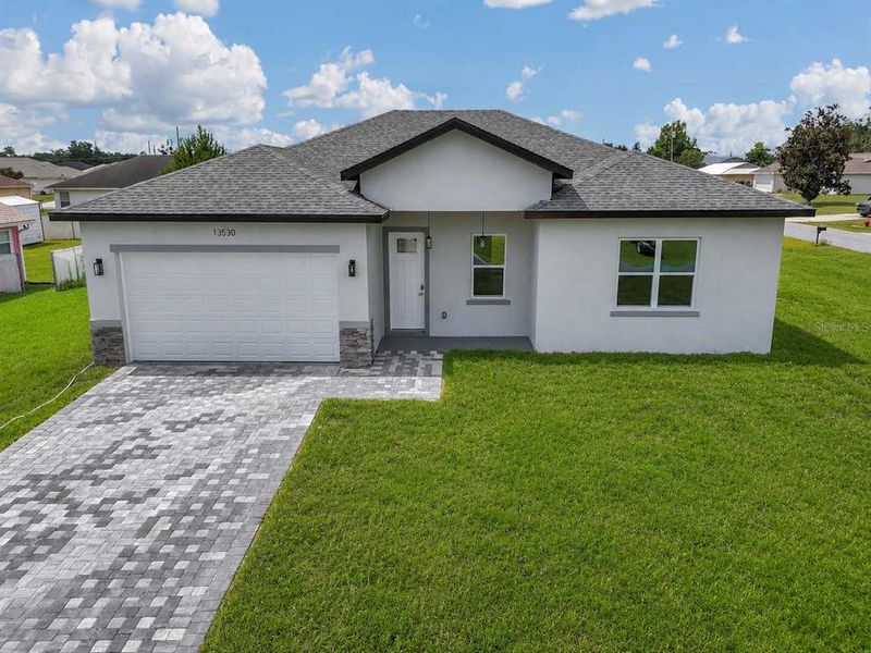 Front exterior of a new home in , Ocala, FL, highlighting curb appeal (Image 21). Front exterior of a new home in , Ocala, FL, highlighting curb appeal (Image 21).