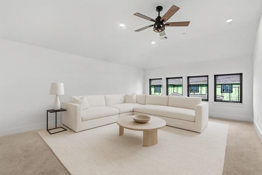 *VIRTUALLY STAGED* Spacious gameroom located upstairs offers extra entertainment space in this functional home.