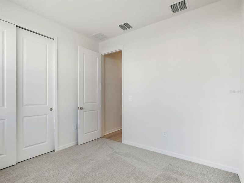 Spacious, unfurnished interior of a new home in Coasterra - Reserve Series, Palmetto (Image 13).