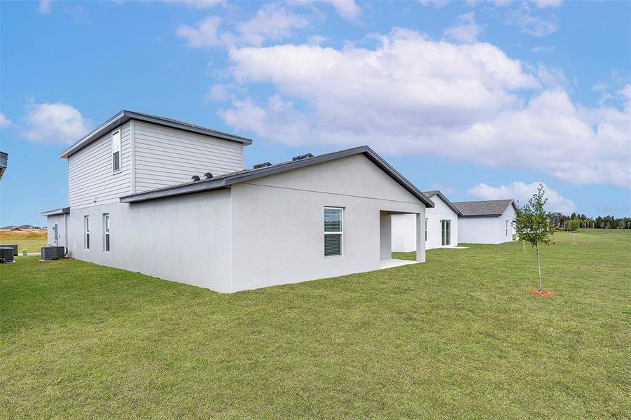 Front exterior of a new home in Trilby Crossing, Brooksville, FL, highlighting curb appeal (Image 1).