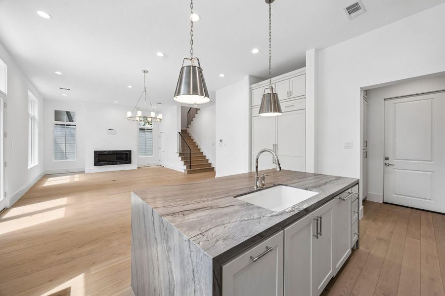 Kitchen features custom Benedettini cabinetry throughout.