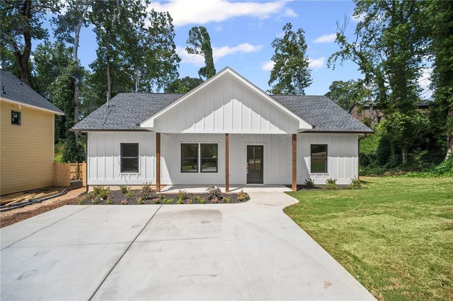 Front exterior of a new home in , Canton, GA, highlighting curb appeal (Image 1).