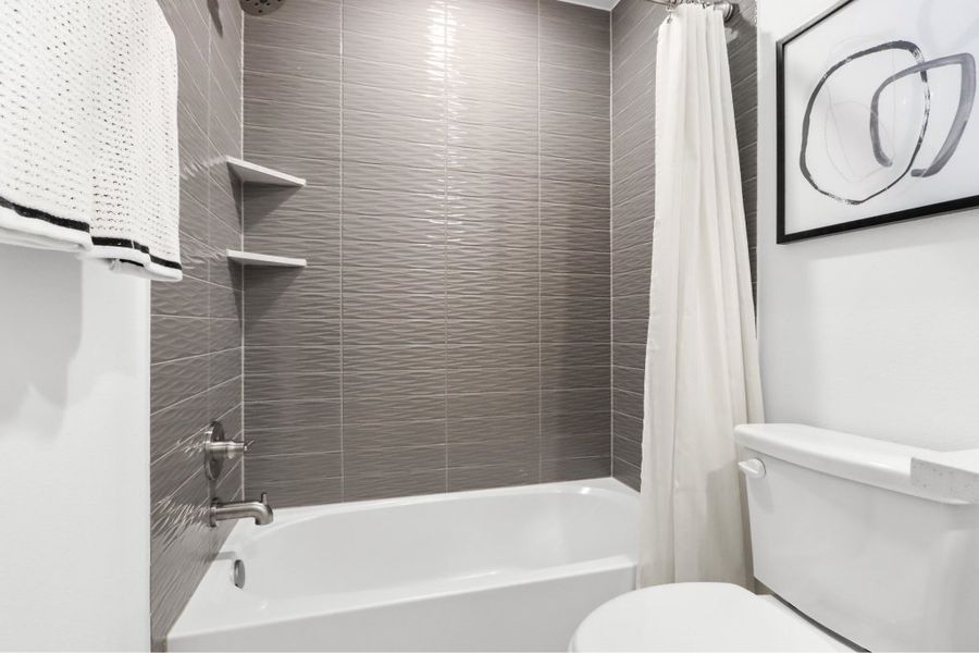 Furnished interior view inside a new home in The Tribute, The Colony (Image 15).
