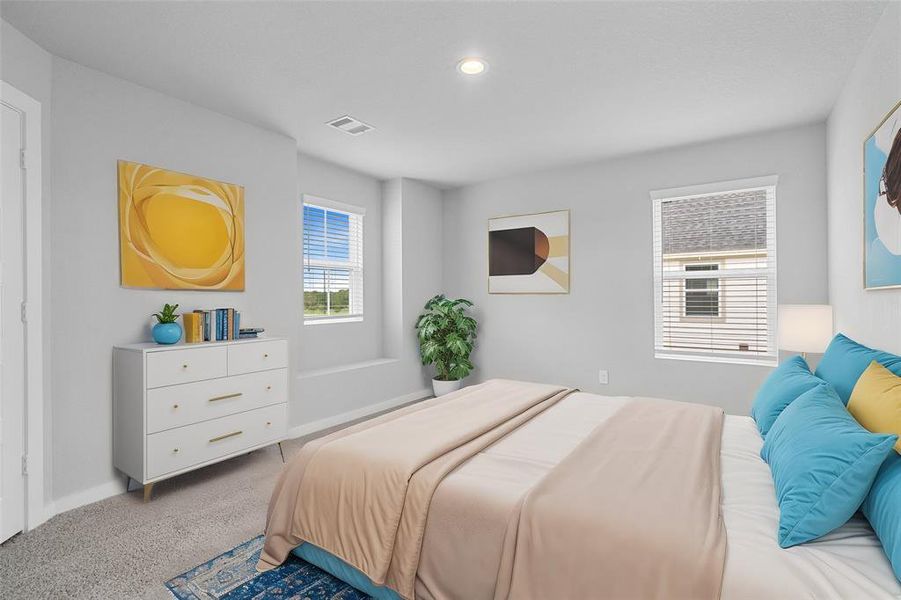 Secondary bedroom features plush carpet, custom paint, lighting, and large window with privacy blinds.