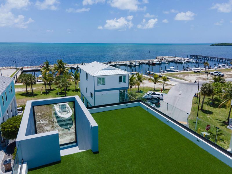 Front exterior of a new home in , Key Largo, FL, highlighting curb appeal (Image 24).