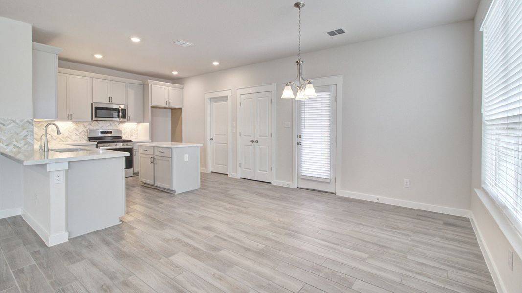 Representative furnished interior of a home built from the Majestic by Brightland Homes in Sunterra, Katy (Image 6).