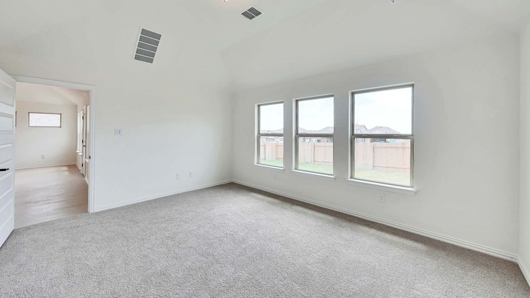 Representative furnished interior of a home built from the Palm by Brightland Homes in Sunterra, Katy (Image 8).