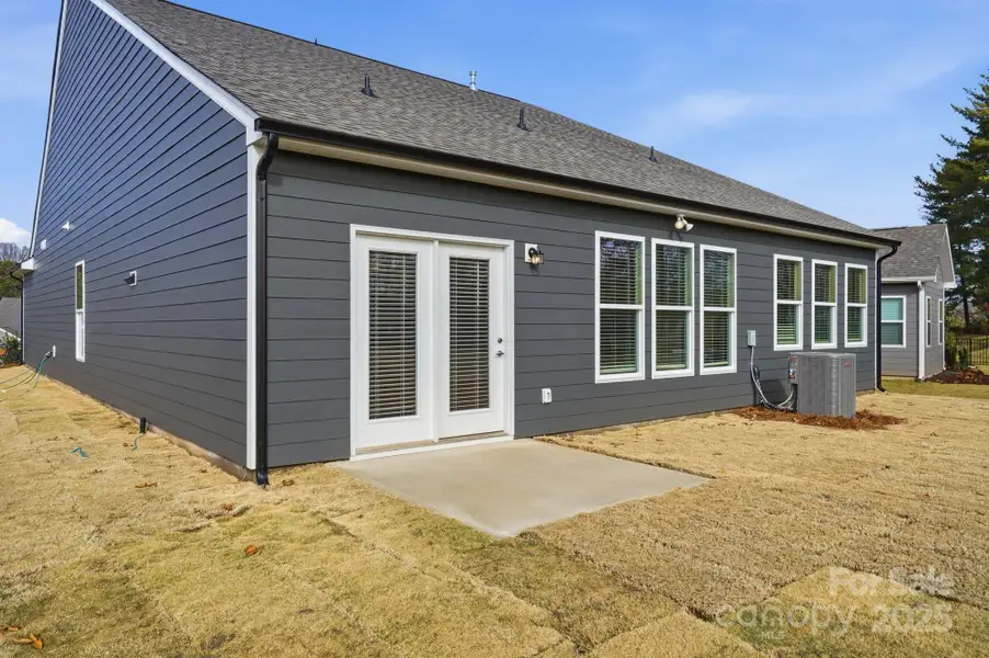 Exterior details and patio area of a home in Villas at Prestwick, Mooresville (Image 3).