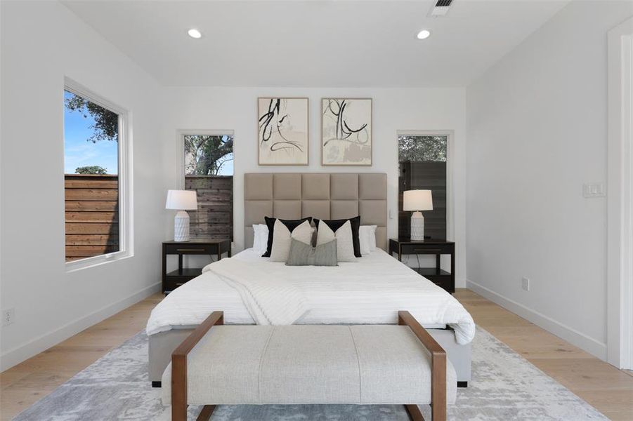 Bedroom with recessed lighting and wood finished floors