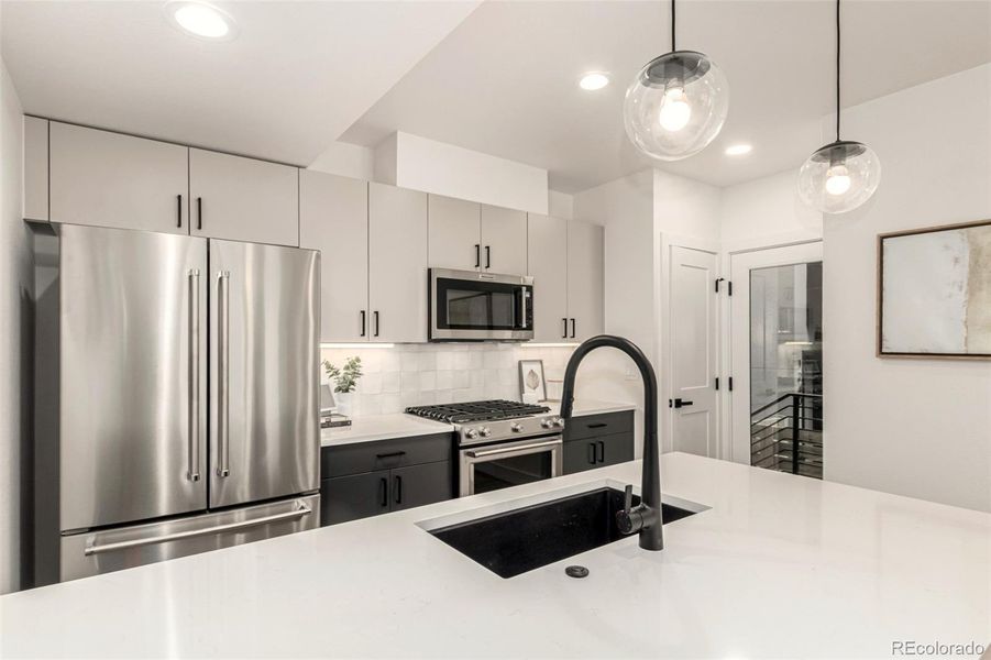 Eat in kitchen, stainless steel appliances, custom cabinets.Counter space, storage, large pantry.