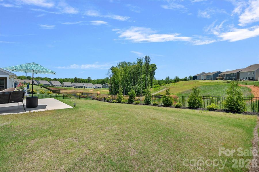 Fenced backyard with landscaping