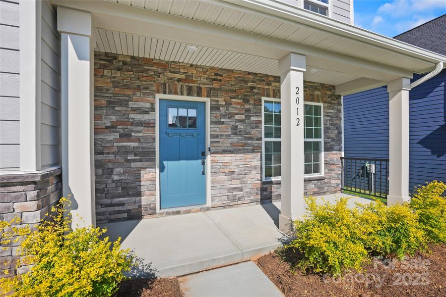 Exterior details and patio area of a home in Forest Creek, Waxhaw (Image 22).