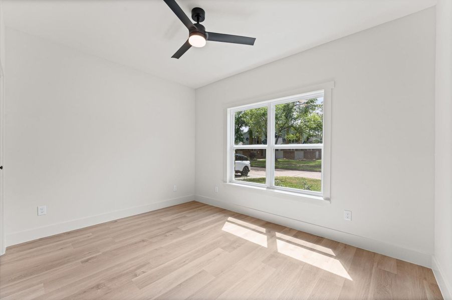 Bedroom #2 in the front of the home with a lovely double window.
