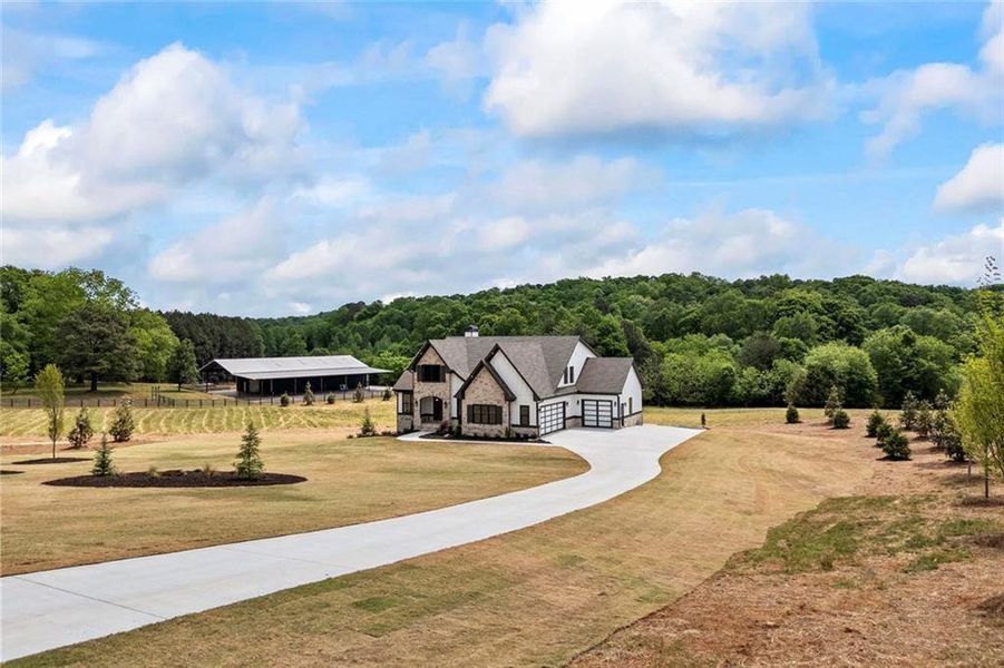 Front exterior of a new home in , Monroe, GA, highlighting curb appeal (Image 29). Front exterior of a new home in , Monroe, GA, highlighting curb appeal (Image 29).