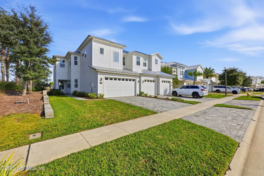 Front exterior of a new home in , St. Johns, FL, highlighting curb appeal (Image 23).