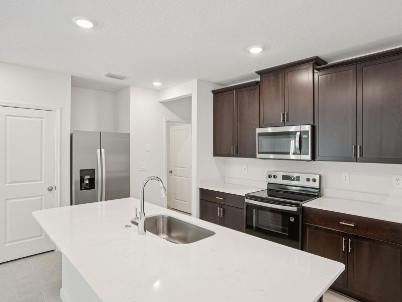 Furnished interior view inside a new home in The Meadow at Crossprairie Townes, St. Cloud (Image 5).