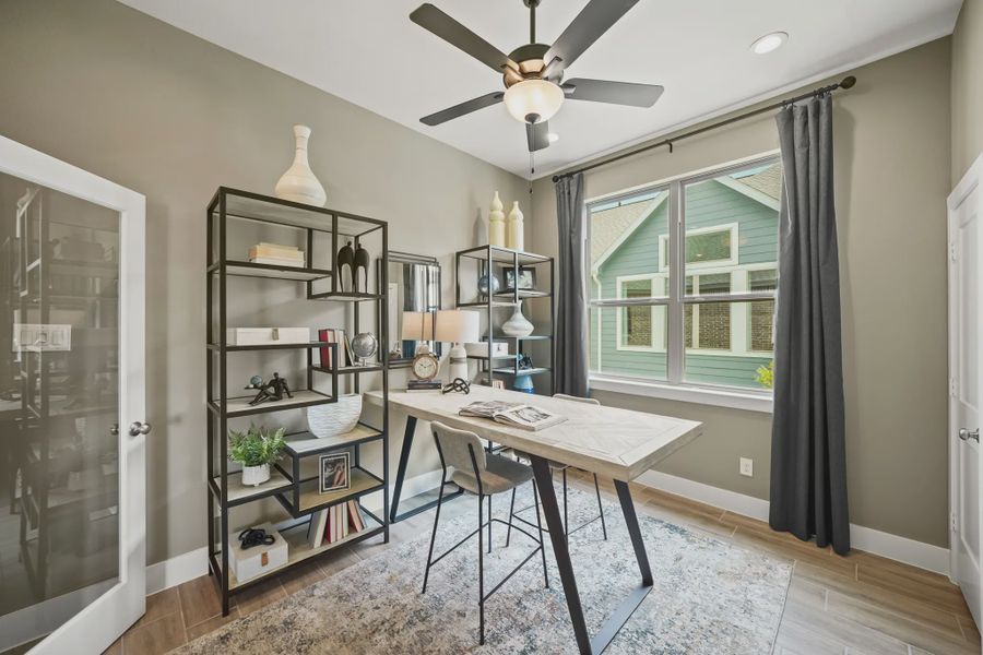 Representative furnished interior of a home built from the Athens by Chesmar Homes in Sunterra, Katy (Image 7).