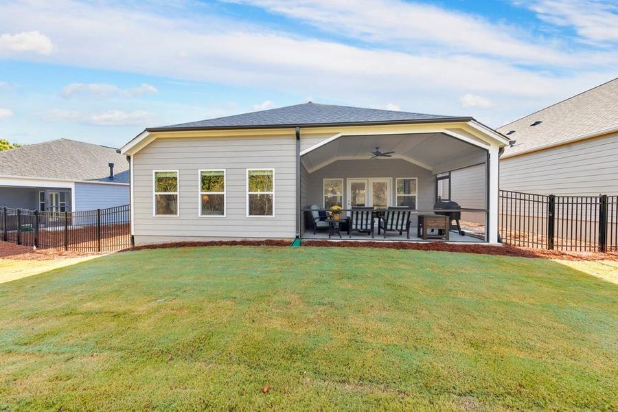Exterior details and patio area of a home in Madeira, Acworth (Image 22).