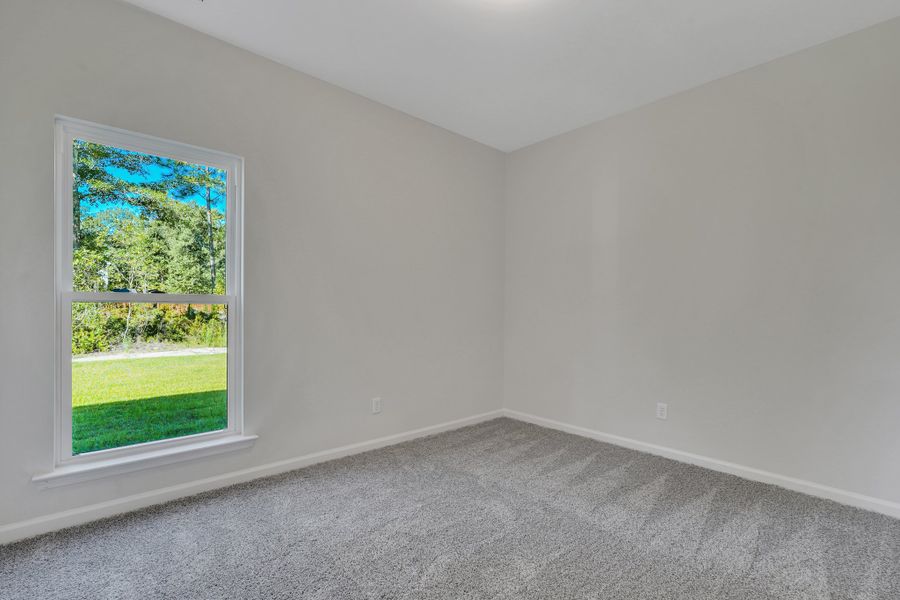 Representative unfurnished interior of a home built from the The Hatteras by Smith Family Homes in Ramsey Landing, Rincon (Image 23).