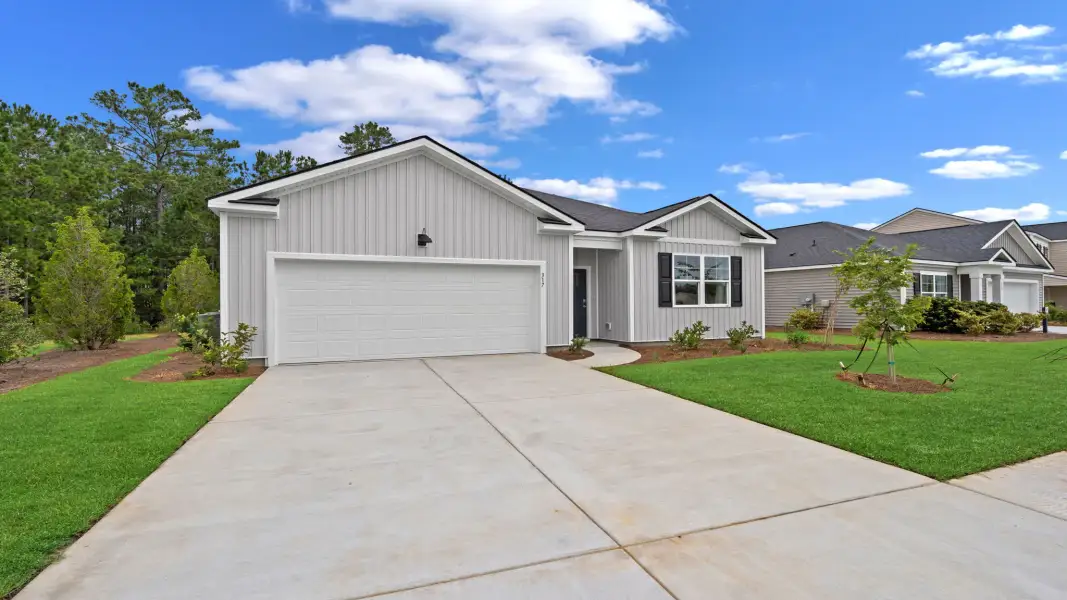 Front exterior of a new home in The Pines at New Hampstead, Bloomingdale, GA, highlighting curb appeal (Image 2).